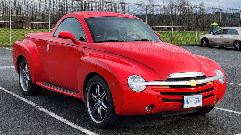 Front 3/4 view of Chevrolet SSR in parking lot next to athletic fields and playground