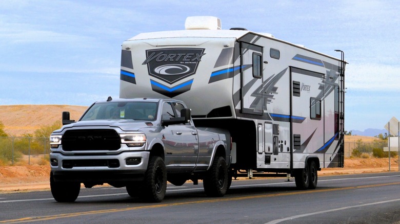 A truck towing another truck