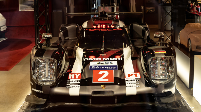 A front-end view of a Porsche 919 Le Mans race car.