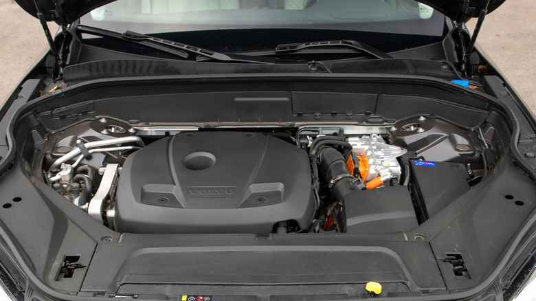 A close-up of a Volvo XC90 four-cylinder hybrid engine.