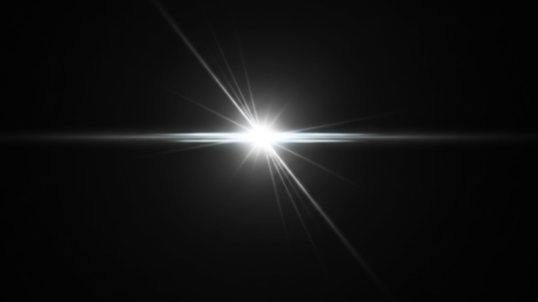 A bright light on a black background.