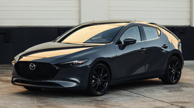 Black Mazda3 hatchback front 3/4
