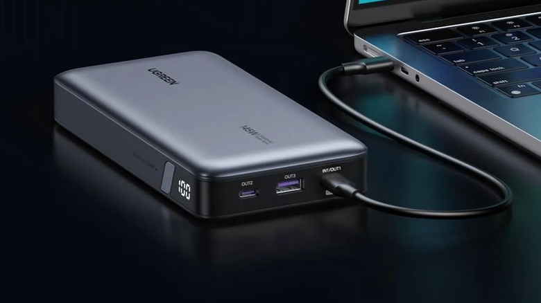 The UGREEN 145W Power Bank used to charge a MacBook