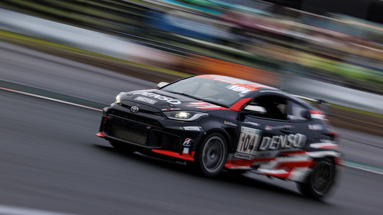 Toyota GR Yaris racing in 24 Hours of Fuji, front-left 3/4 view
