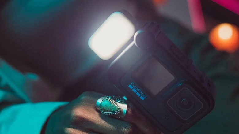 Person holding camera with Light Mod