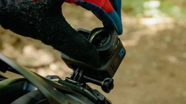 Person attaching Max Lens Mod