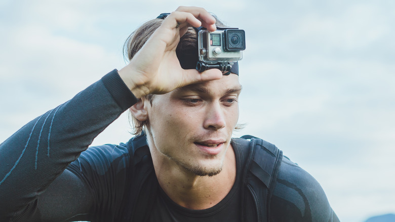 Person adjusting GoPro