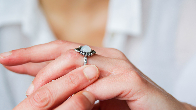woman holding ring