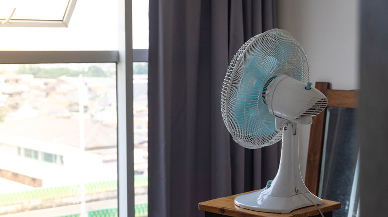 fan facing out a window