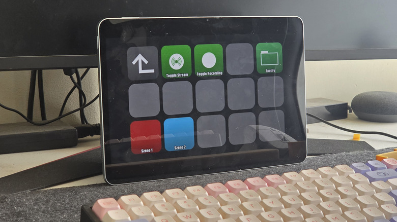 The app Macro Deck running on an Android tablet in front of a computer monitor and a keyboard