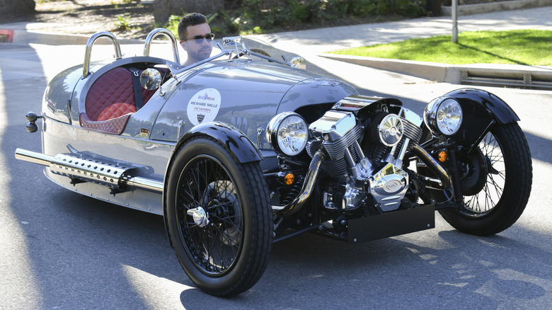 Black Morgan 3 Wheeler with male driver