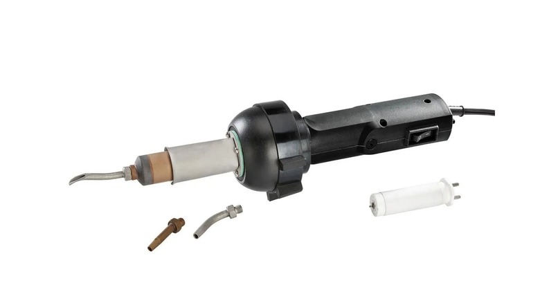 The Chicago Electric 1,600 Watt Plastic Welding kit next to some loose parts, on a white background.