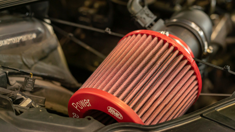 High-performance red cone-type air filter installed in car