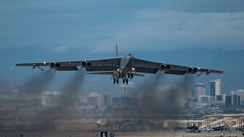 Front view of Boeing B-52 Stratofortress bomber taking off from Nellis Air Force Base.