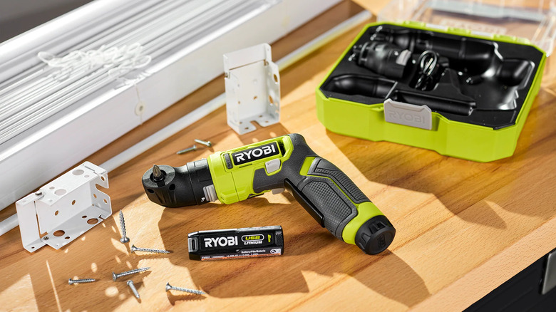 Ryobi USB Lithium multi-head screwdriver with accessories and screws