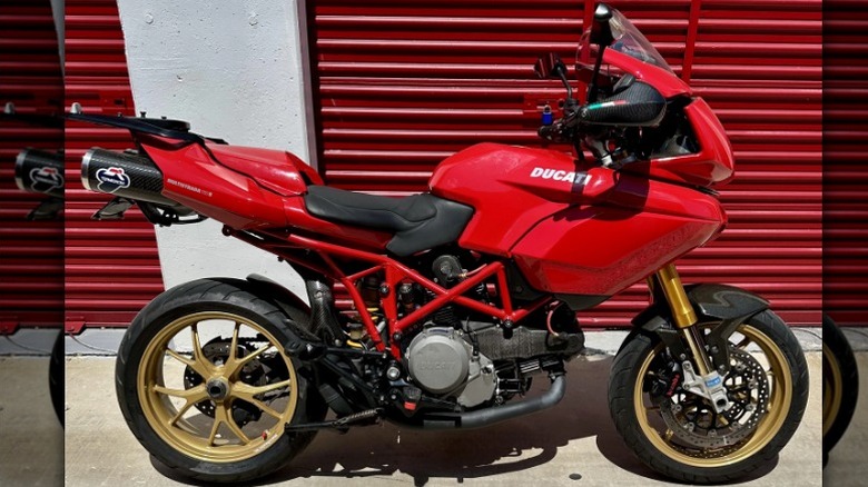 Ducati Multistrada 1000DS parked in front of garage door