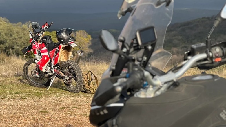 Moto Guzzi Stelvio 1200 parked on trail with dirt bike in front of it