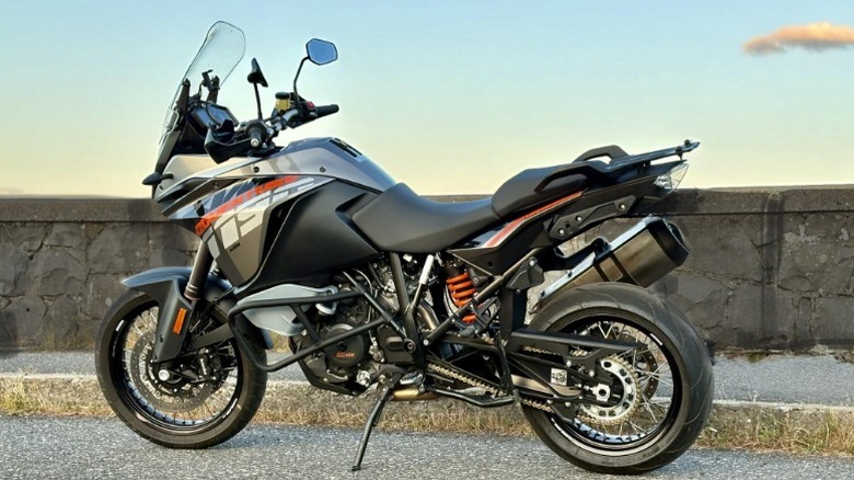 2014 KTM 1190 Adventure parked on street near stone wall
