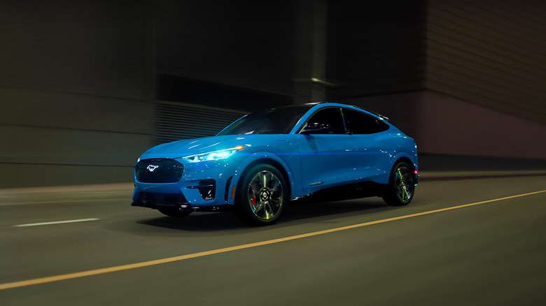 A blue 2023 Ford Mustang Mach-E GT driving