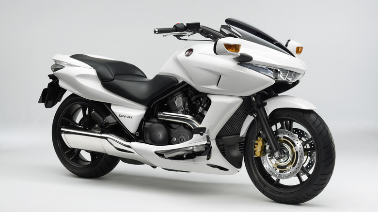 A white Honda DN-01 from 2008 standing at an angle to the camera, against a white studio background.