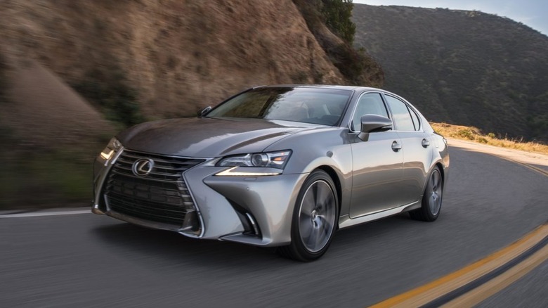 Silver Lexus 200t driving on a mountain road