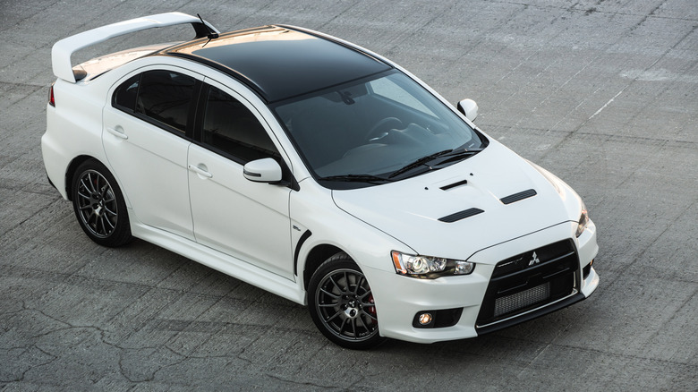 A white Mitsubihsi Evo X Final Edition, front 3/4 view, high angle