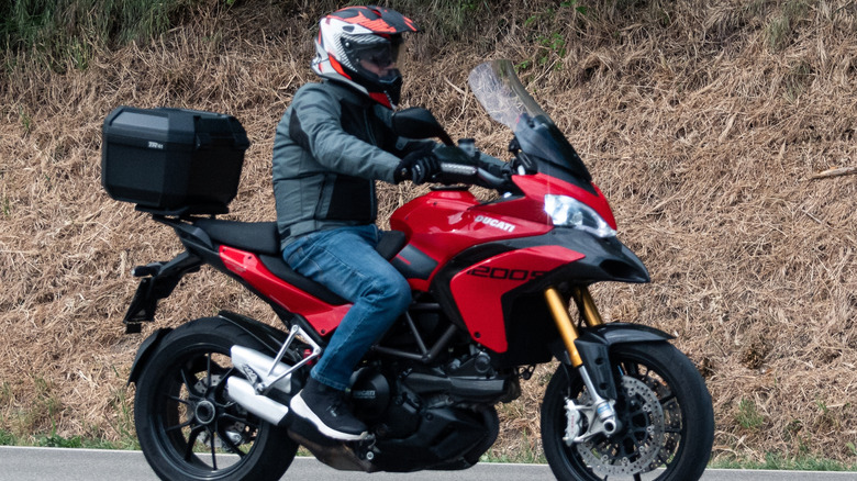 Person driving Ducati Multistrada 1200S.