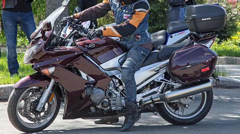 Rider sitting on a Yamaha FJR1300, ready to go.