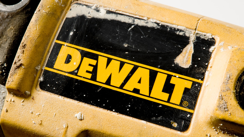 A damaged DeWalt logo on a power tool.