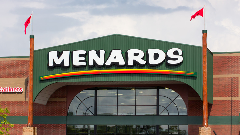Flags flying over Menards storefront