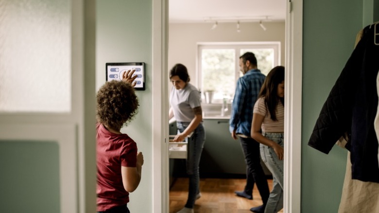 A family interacting with tech in a home