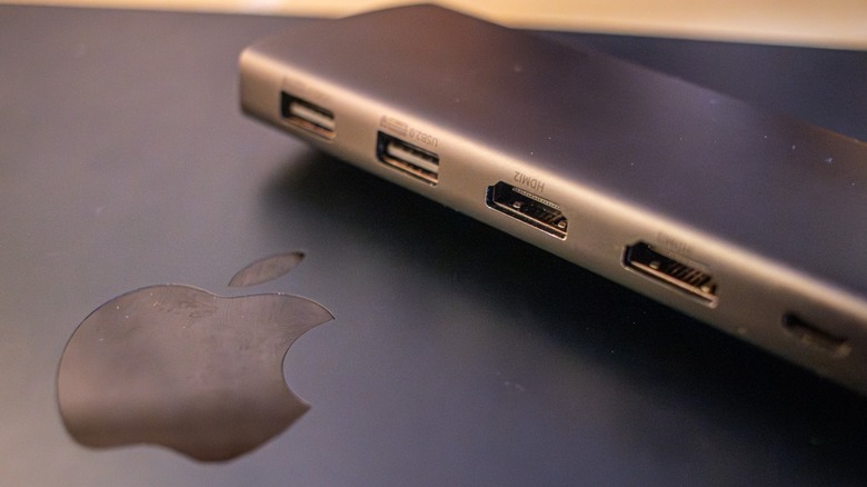 A USB hub with two HDMI ports on a MacBook.