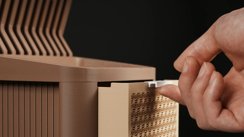 person opening tablet stand drawer