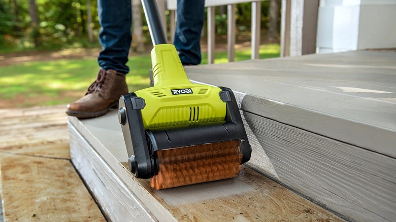 Ryobi patio cleaner with scouring brush cleaning stairs