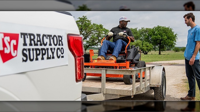 Tractor Supply employee delivering package to a customer.