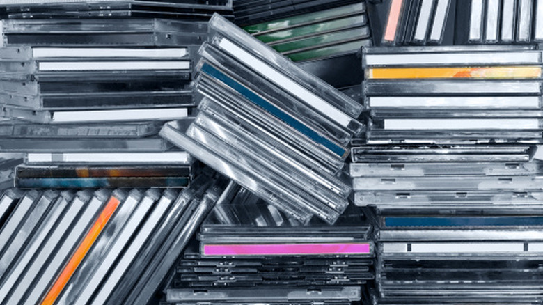 Multiple CDs in jewelcases stacked haphazardly