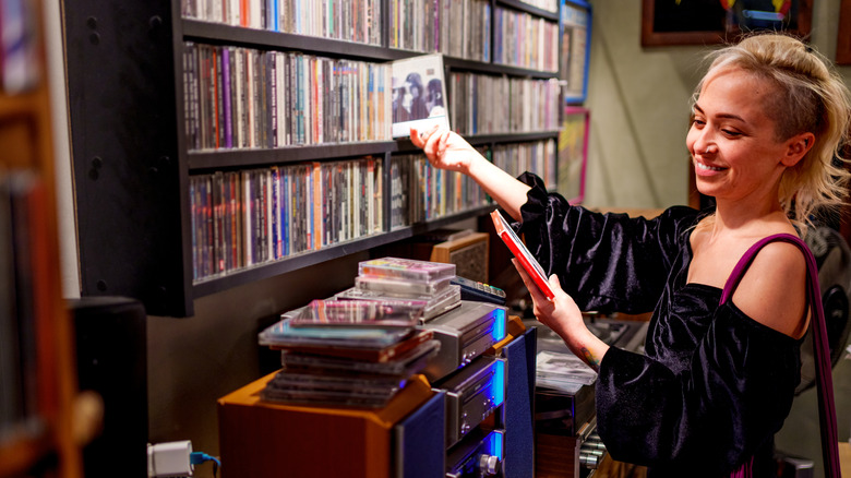 Young woman browsing CDs