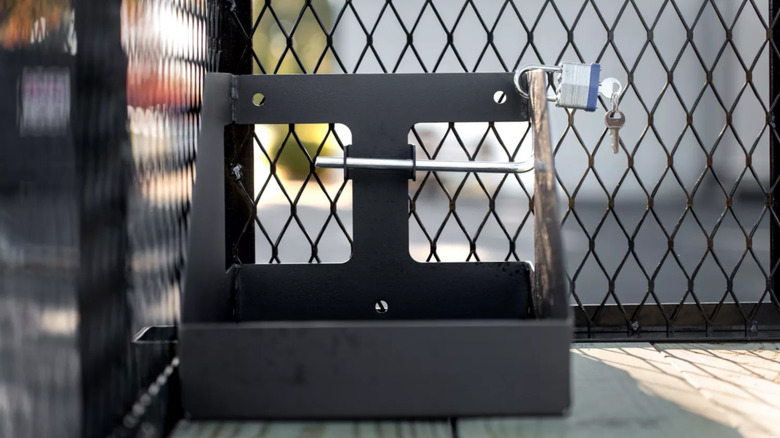Locking gas can pictured in the back of a trailer