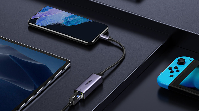 A Ugreen USB-C to Ethernet cable connected to a phone.