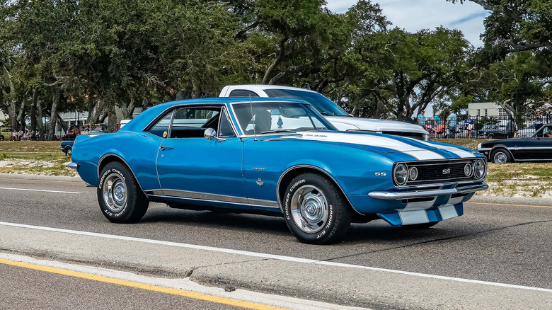 A blue 1967 Chevrolet 350 SS Camaro on the street