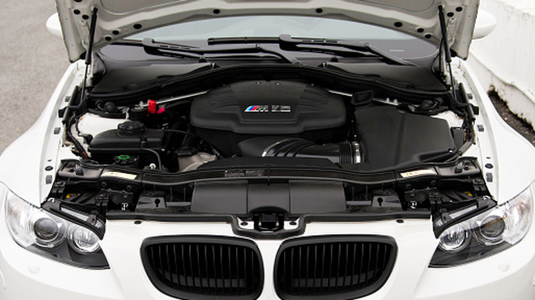 Front view of 4.0 V8 engine in white BMW M3 engine bay.