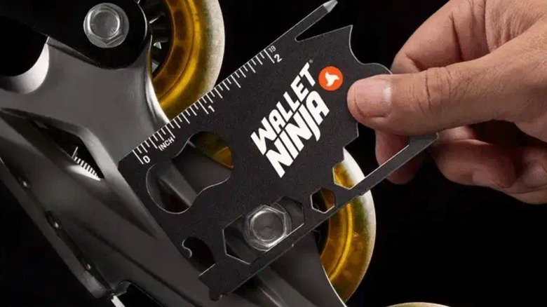 Wallet Ninja used to tighten a roller blade fastener