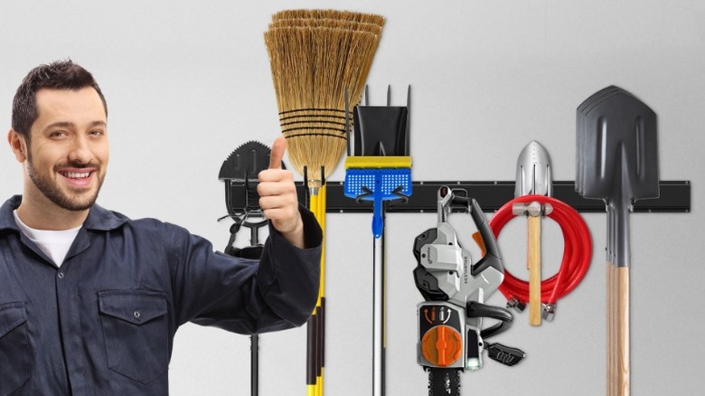 Man giving thumbs up in front of Riousery Garage Tool Organizer