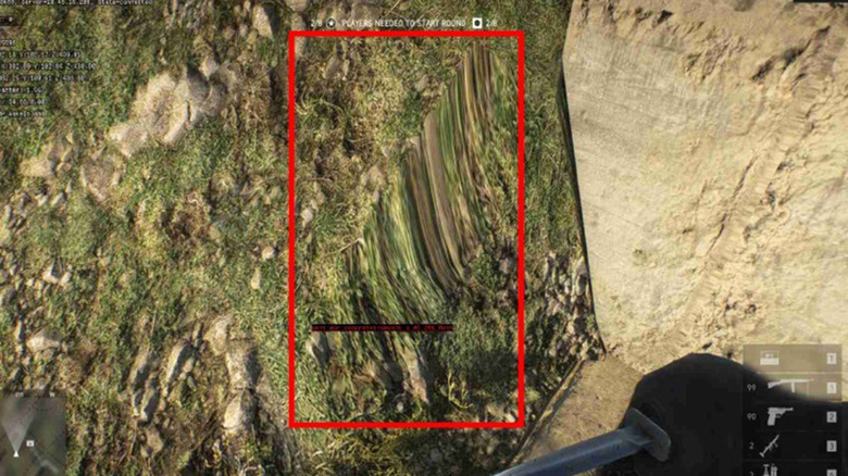 A graphical glitch in the terrain of a video game outlined by a red box.