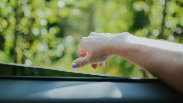 Hand hanging out of window