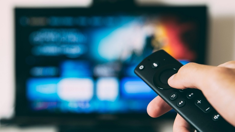 Person using Fire TV Stick Remote