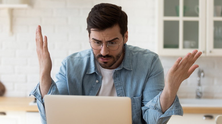 Man frustrated with his laptop