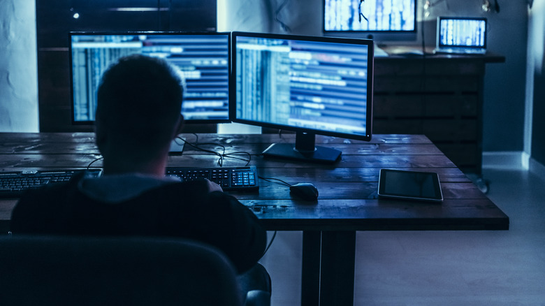 man watching monitors