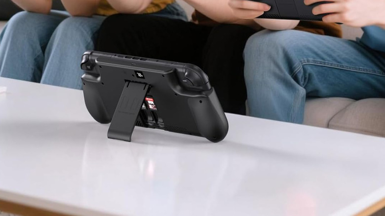 A Mavulo battery pack attached to a Nintendo Switch 2 on a table using its kickstand