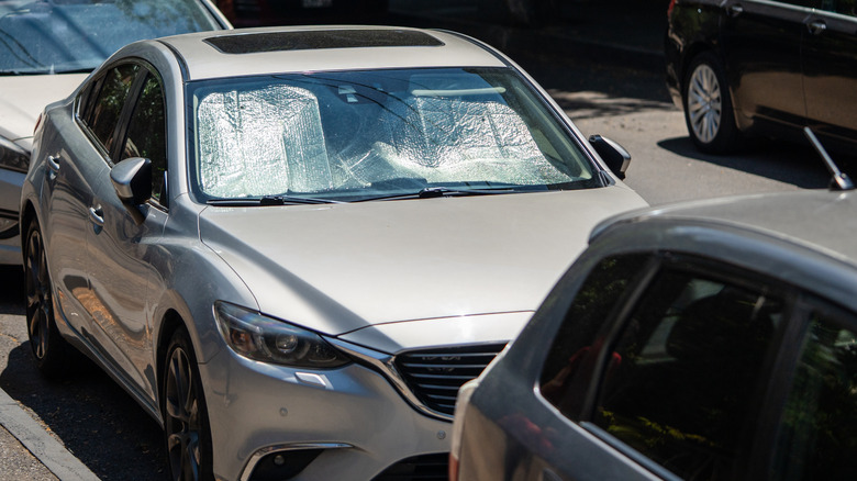 car with windshield sunshade